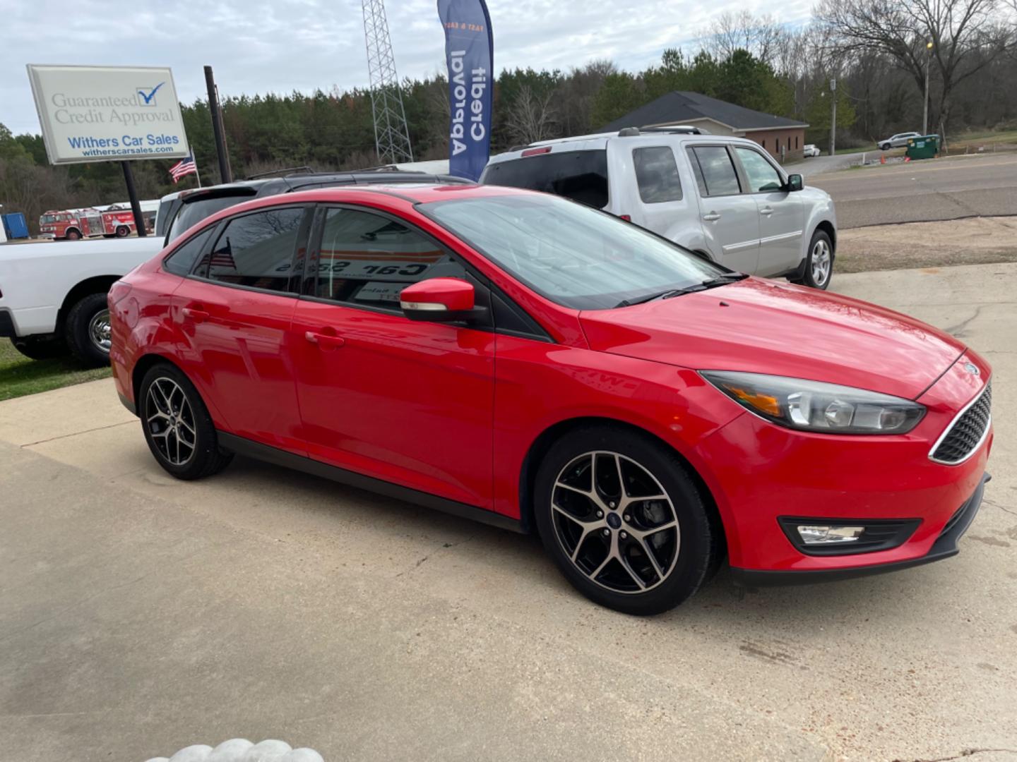 2017 RED /BLACK Ford Focus (1FADP3H29HL) with an 2.0L engine, AUTO transmission, located at 204 Hwy. 16 East, Carthage, MS, 39051, (601) 267-7277, 0.000000, 0.000000 - Photo#1